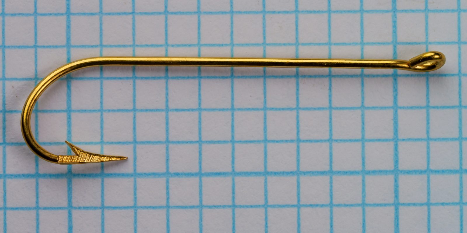 Pflueger Carlisle hook size 6 — top-down profile showing eye, shank, and straight ring eye — gold plated finish