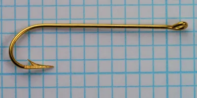 Pflueger Carlisle hook size 6 — top-down profile showing eye, shank, and straight ring eye — gold plated finish