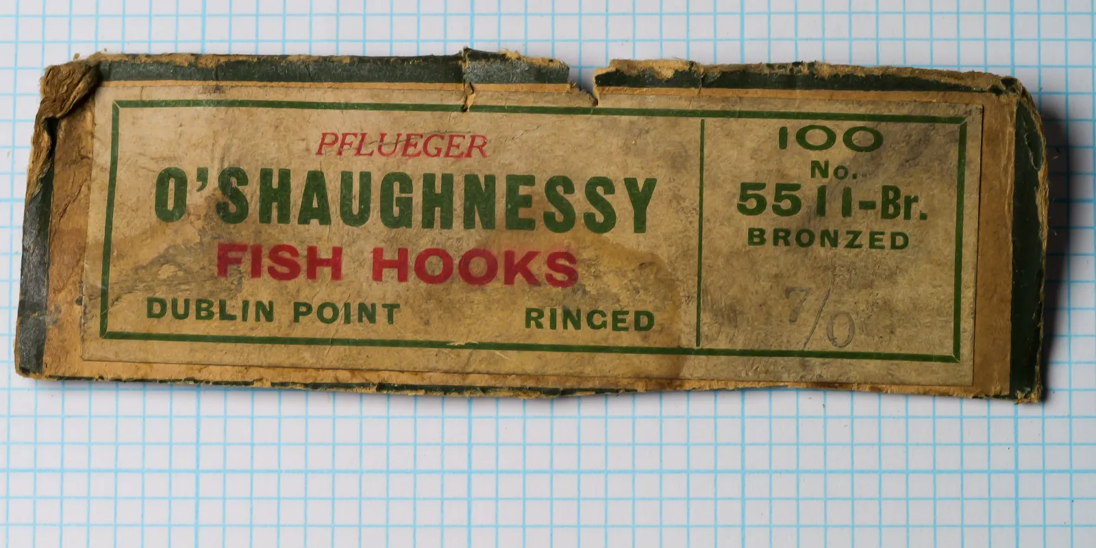 Pflueger O'Shaughnessy 100-count box original packaging — model 5511-Br Bronzed — red and green letterpress printing — hinged cardboard construction