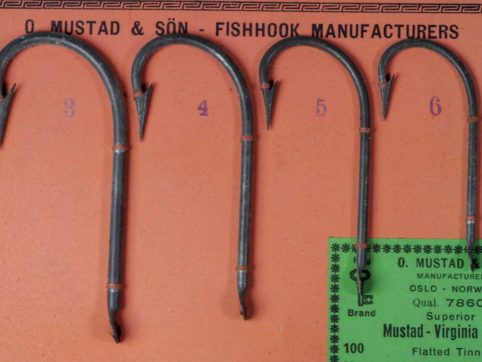 Mustad 7860 Virginia Hooks sales demonstration card — four sizes (3–6) mounted on lime-green card with Key Brand logo and black offset printing
