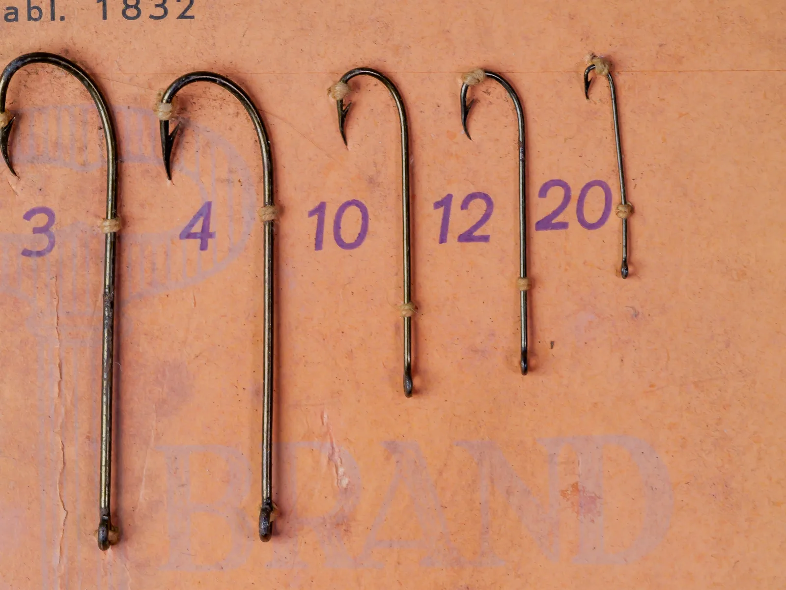 Right side of a Mustad 93400 sales card with mounted Carlisle hooks in sizes 3, 4, 10, 12, and 20.