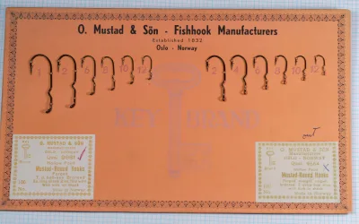 Mustad 9664 Complete Sales Card — Full packaging showing orange card stock with measurement grid, hook display, and original label elements
