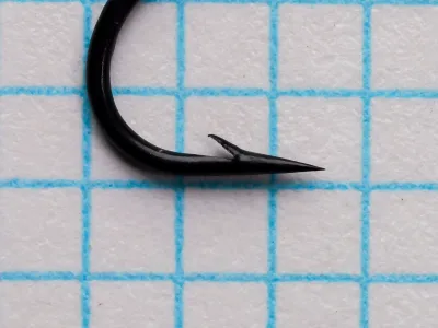 Point and barb of a Partridge Single Wilson size 12 hook on grid paper.