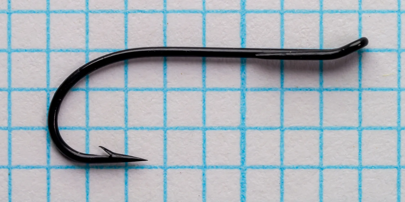 Partridge Single Wilson size 12 hook in side view on grid paper.