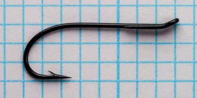 Partridge Single Wilson size 12 hook in side view on grid paper.