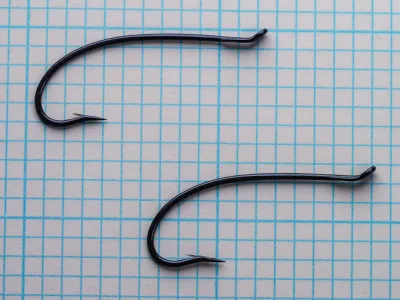 Two Partridge CS 22 Spey hooks showing size comparison and sproat bend consistency