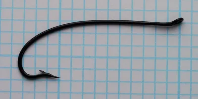 Partridge CS10 Size 6 — full-length dorsal view showing Bartleet bend profile and looped up-eye — japanned black finish — measured on grid