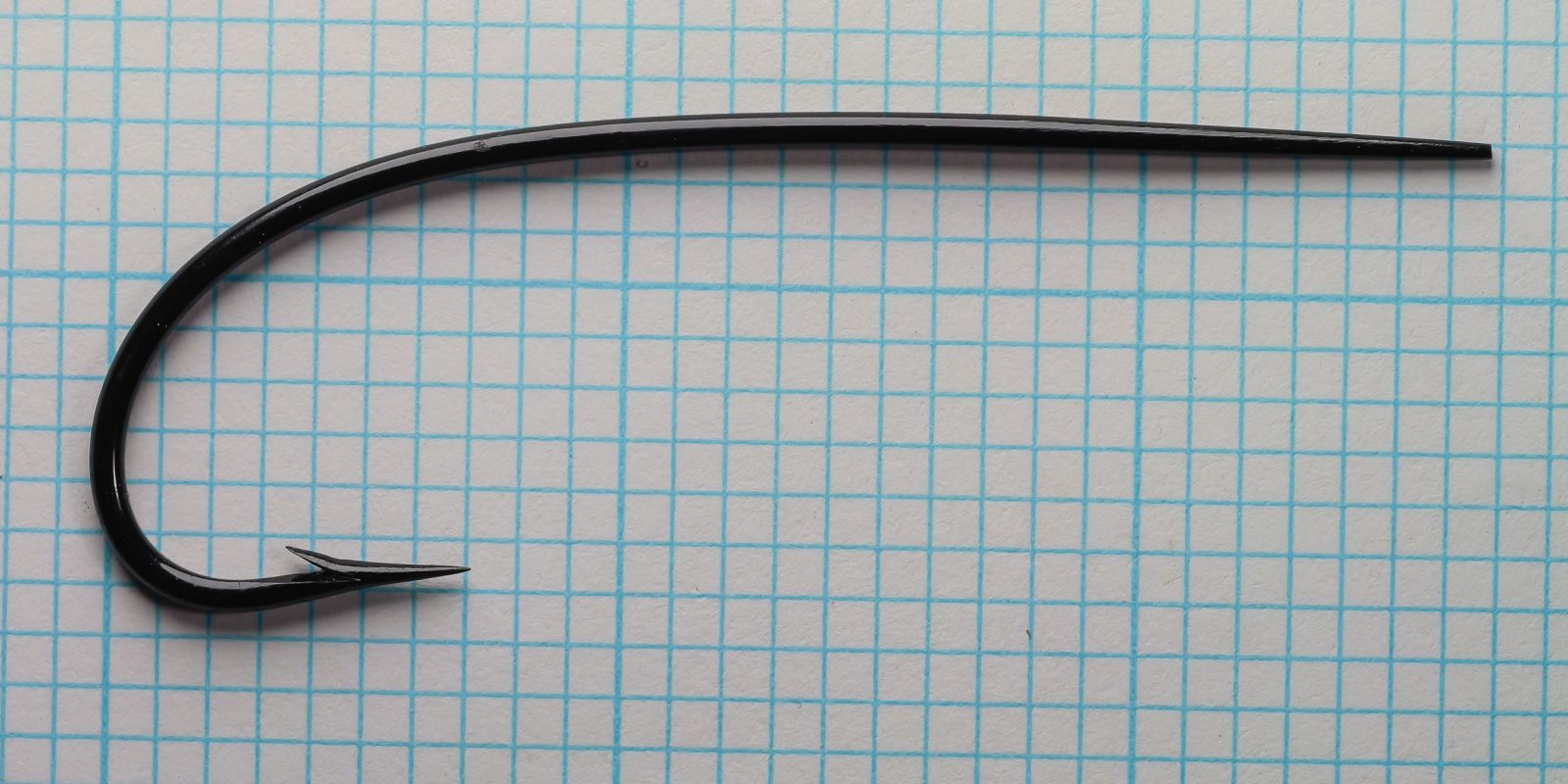 Partridge CS7DB Dublin Bend — full hook profile showing shank and bend curve — size 7/0 — on measurement grid
