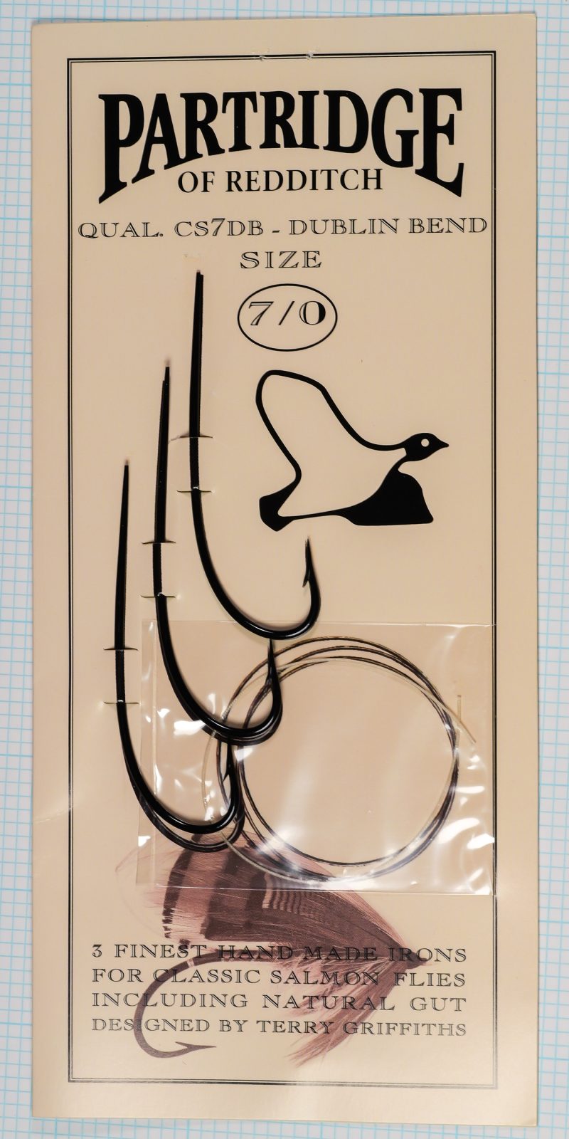 Partridge CS7DB Dublin Bend — package and contents showing three hooks and silkworm gut — size 7/0 — on measurement grid