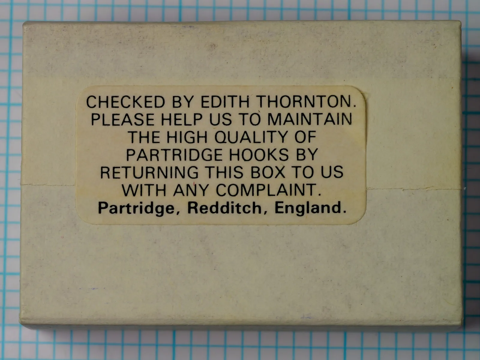 Partridge K2B Yorkshire Caddis Hook — reverse side of original cardboard box showing quality-control text and manufacturer attribution — hand-written signature area