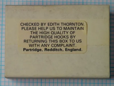 Partridge K2B Yorkshire Caddis Hook — reverse side of original cardboard box showing quality-control text and manufacturer attribution — hand-written signature area