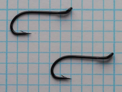 Single blued salmon hook with prominent loop eye and tapered shank