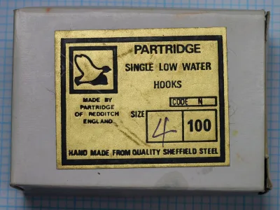 Partridge Code N Single Low Water — yellow and black label on cardboard box — size 1/0 — hand-marked notation visible