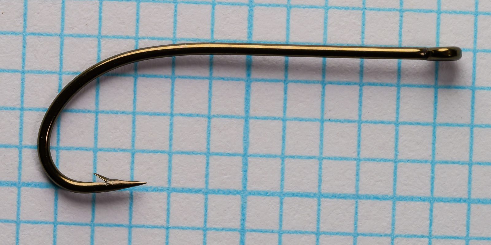 Partridge D3ST Size 6 hook single — close-up side profile — full shank from eye to bend, forged geometry, ring eye closure, bronze finish detail