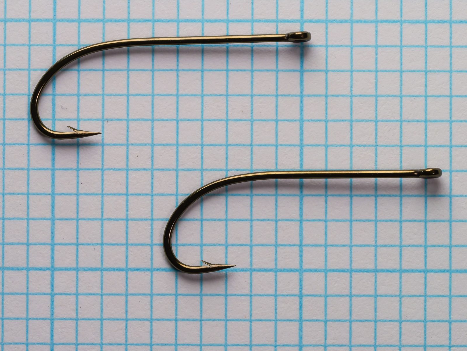 Partridge D3ST Size 6 hooks pair — side profile view on 1/10-inch measurement grid — showing continuous forged Sproat round-bend geometry, straight ring eye, bronze finish