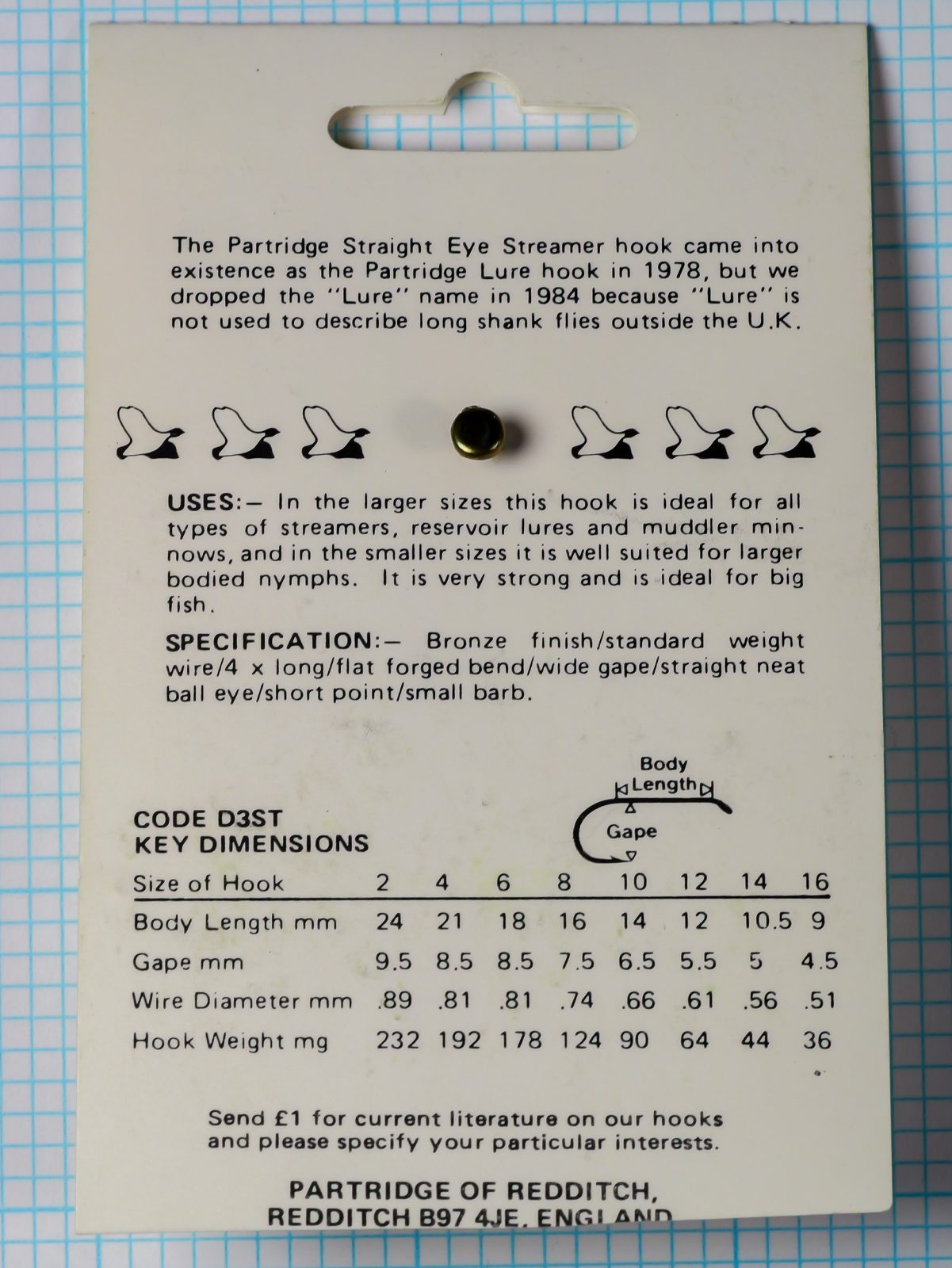 Partridge D3ST Size 6 package reverse specification panel — comprehensive hook dimension table showing sizes 2–16 with body length, gape width, wire diameter, and hook weight in metric — historical 1978–1984 narrative text
