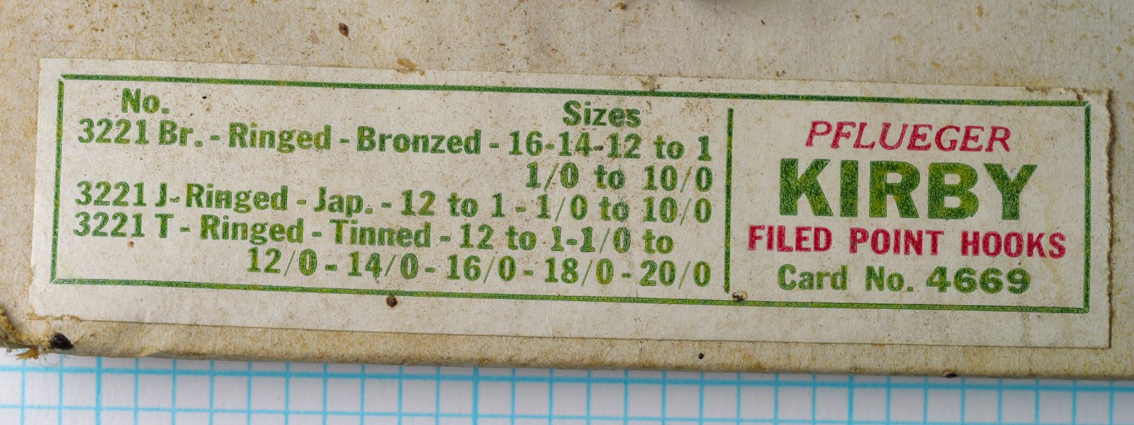 Pflueger Kirby sales card — printed label panel showing detailed model and size information for three Kirby variants: bronzed, japanned, and tinned finishes