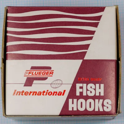 Pflueger Sobey 8515T Size 11/0 — cardboard box with red Pflueger International branding — Pflueger shield logo visible
