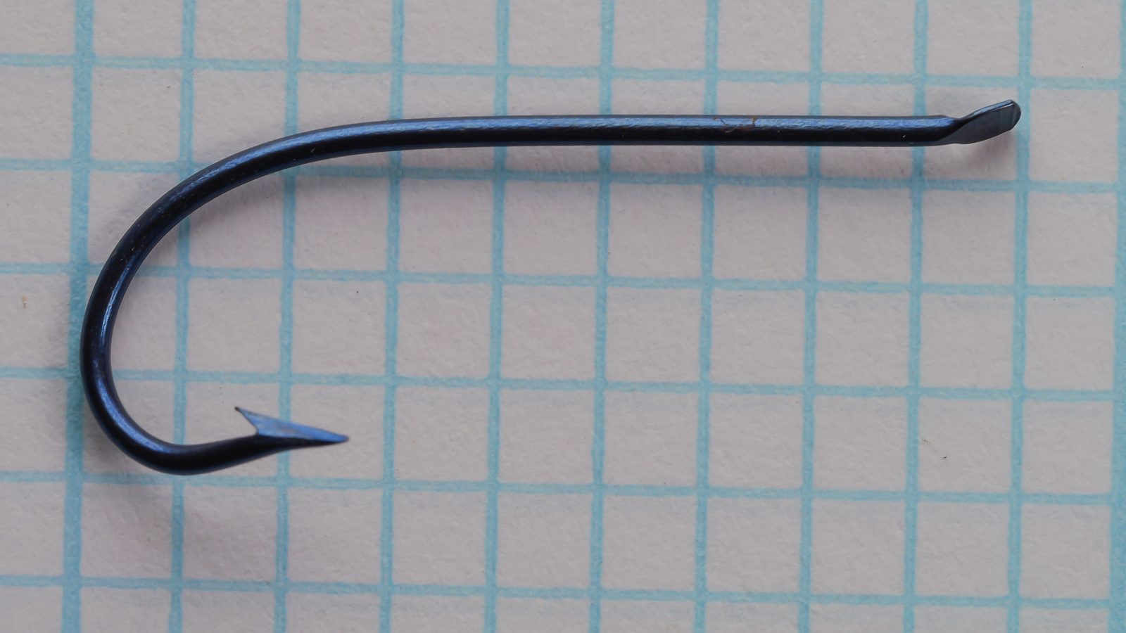 American Fish Hook and Needle Company hook — profile view showing full hook geometry — Size 4 — demonstrating shank length, gap width, and Kirby bend curvature