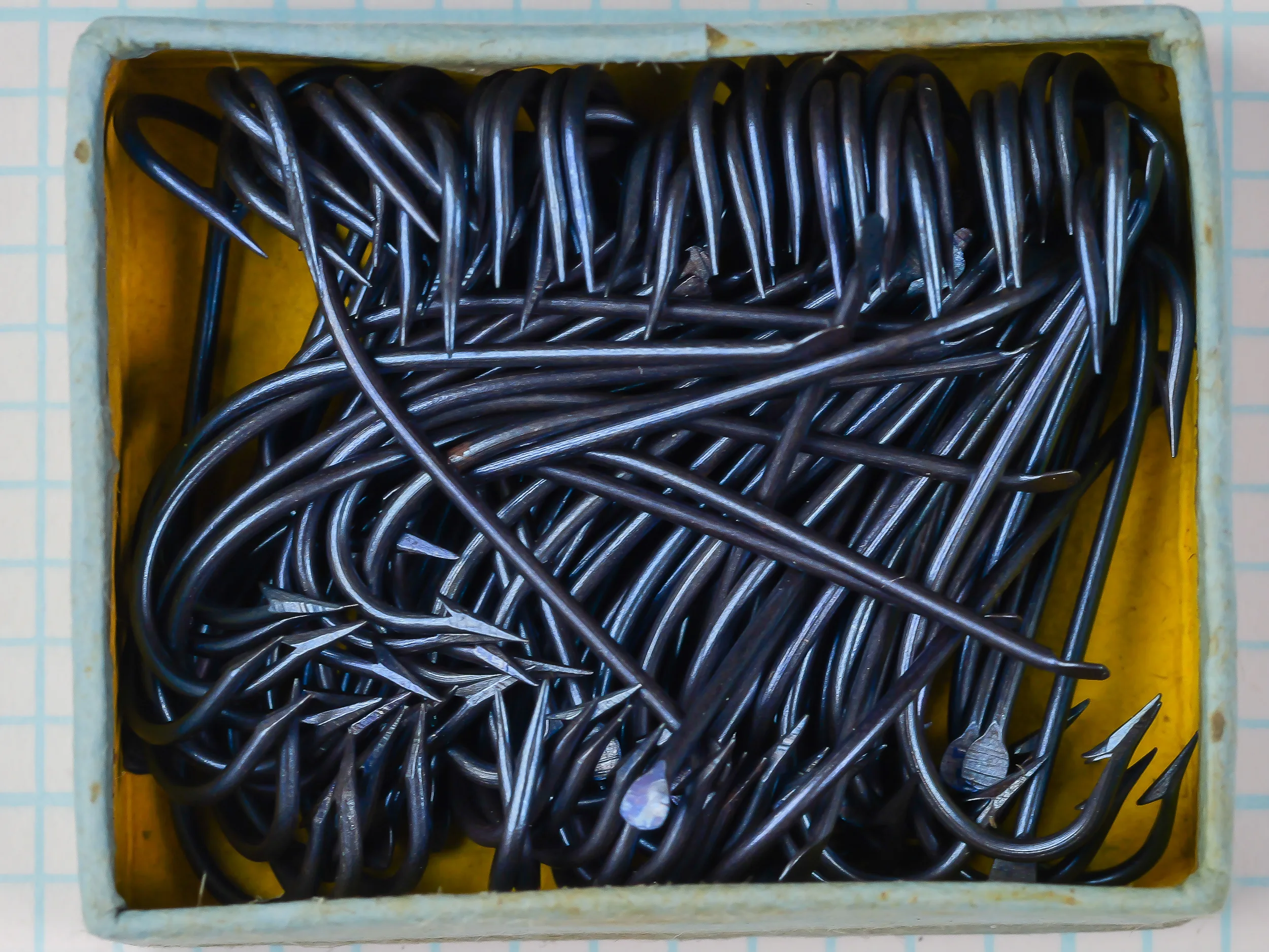 American Fish Hook and Needle Company — hooks in original factory box — Size 4 — showing bundle arrangement and yellow tissue wrapping