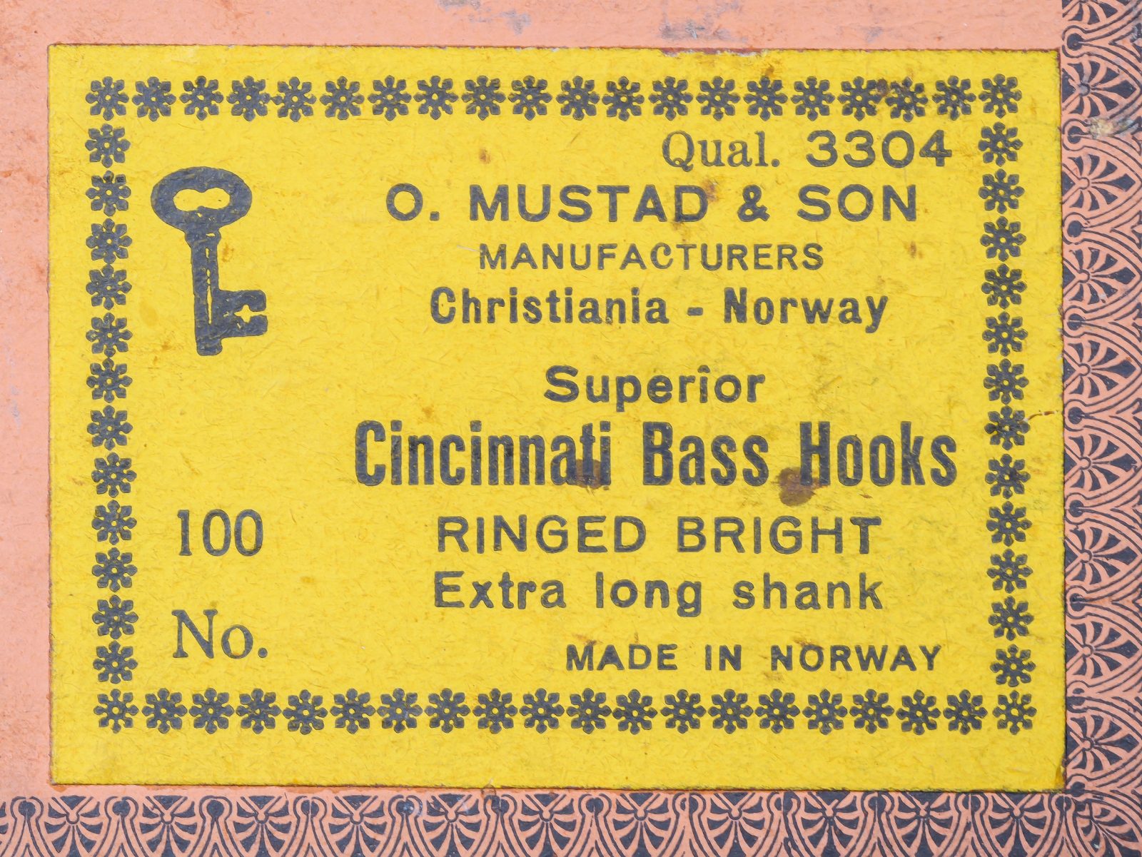 Mustad 3304 sales card — yellow packaging label — Christiania Norway — Superior Cincinnati Bass Hooks text