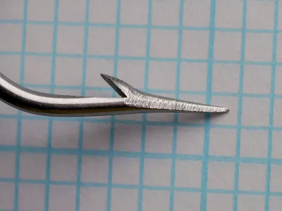 Mustad 3750 Cincinnati Bass Hook — point and barb detail — size 15 — hollow-point geometry showing concave inner face