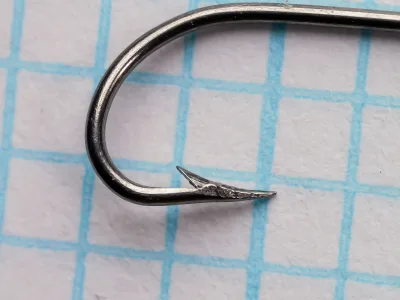 Mustad 3750 Cincinnati Bass Hook — point and barb detail — size 28 — hollow-point geometry showing concave inner face