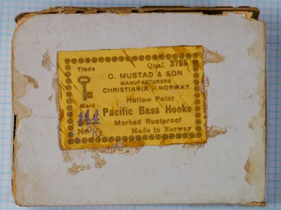 Mustad 3785 Pacific Bass Hooks — original cardstock box label — size 3/0 — yellow-gold letterpress label with Key Brand logo and 'Marked Rustproof' designation
