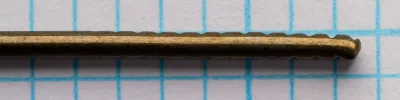 Mustad 3785 — marked shank close-up detail — size 3/0 — file-cut notches on terminal wire for snood grip