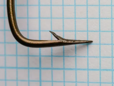 Mustad 3866 Quality Sneck Hook — point detail showing hollow point geometry — size 6/0 — bronzed finish