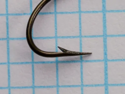 Mustad Qual. 3959 — Hook point and barb detail — size 12 — showing hollow-point geometry and hand-ground taper