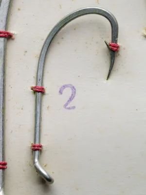 Mustad 92628 ST — full hook profiles sizes 1 and 2 — turned-down ball eye, long shank, forged wire — measurement grid background