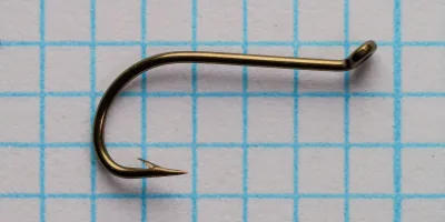 Partridge Model B Widegape Up Eye Hook — side profile showing sproat bend and looped up-eye — size 10 — bronzed finish on measurement grid