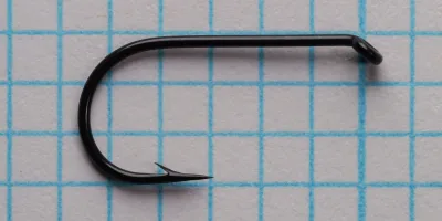 Two Partridge CS7 MW size 10 hooks shown from inside bend view on measurement grid, displaying wide gape geometry and looped eye alignment