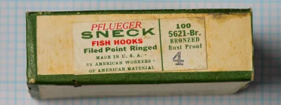 Pflueger Sneck No. 4 — original 100-count cardstock box showing front label and right panel marking — size 4 — bronzed finish, filed point, ringed