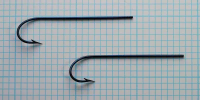S. Allcock No. 1770 Kirby Carlisle multiple hook specimens — comparative size and consistency — Size No. 1 — measurement grid background