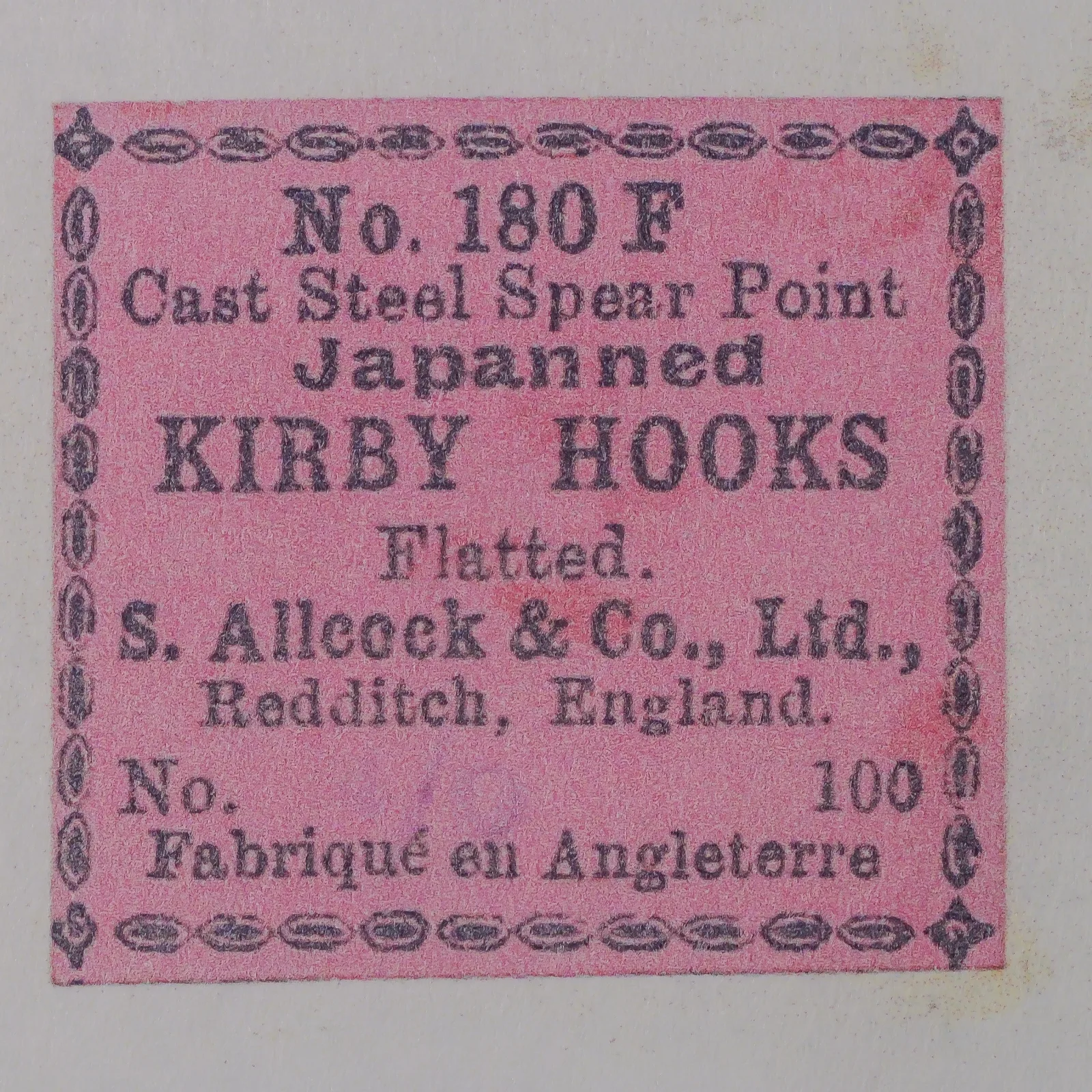 S. Allcock 180 F Kirby Hook — Original pink paper packaging label — Size 4/0 — Japanned flatted-eye design