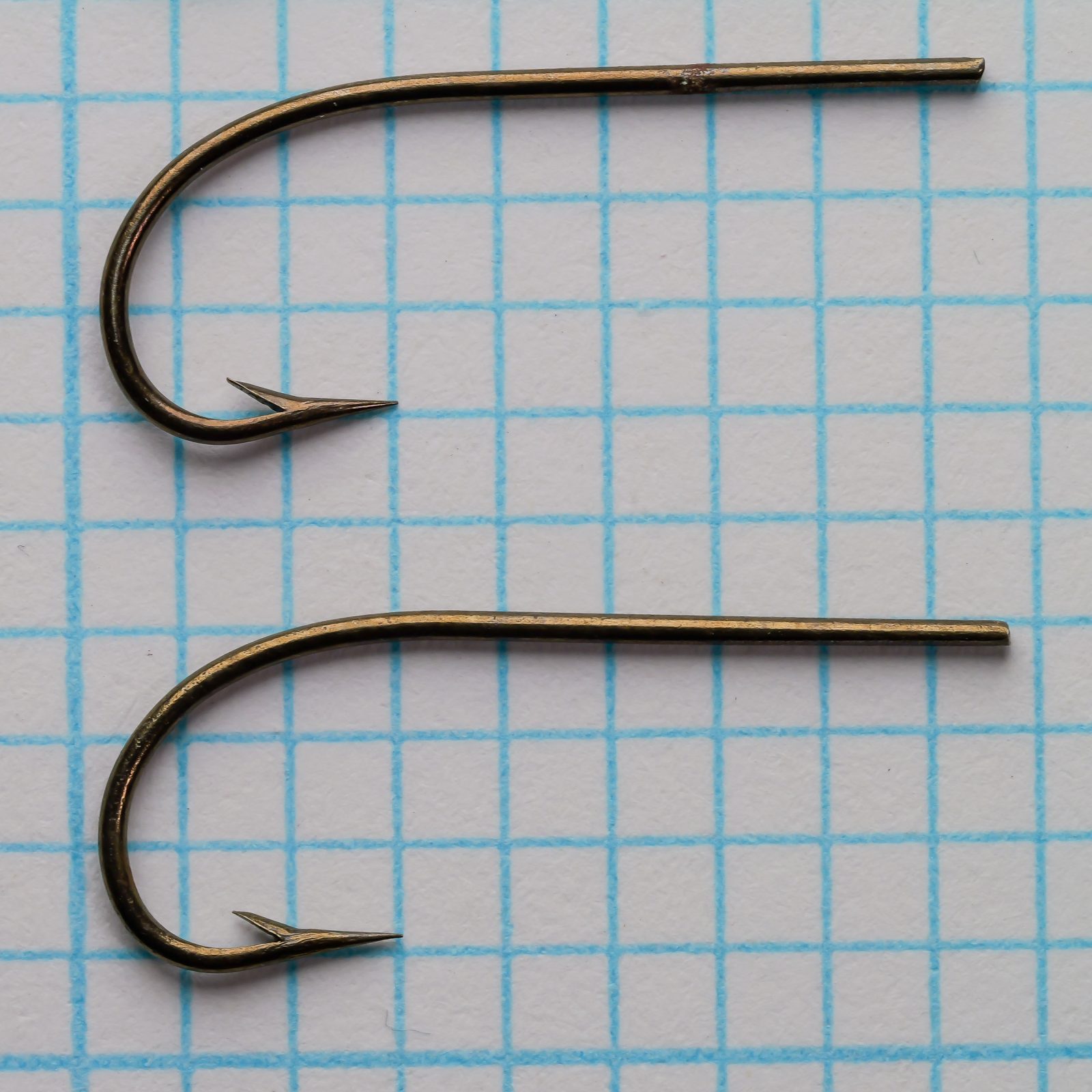 Wm. Bartleet & Sons M64 Sproat Size 6 — two hooks in profile showing the rounded Sproat bend profile and consistent gape width on measurement grid