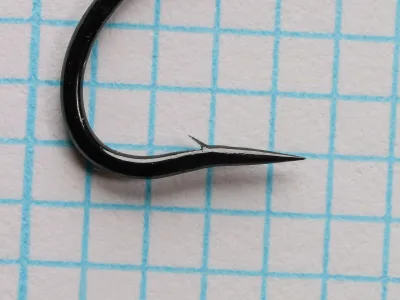 Daiichi 2051 — hook profile showing tapered loop eye and needle point — size 3 — japanned finish, side view