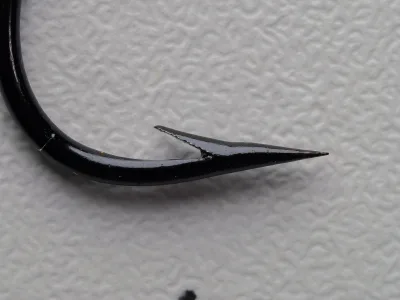 Milward 2867 — hook point macro photograph — showing hollow-point geometry and finish condition