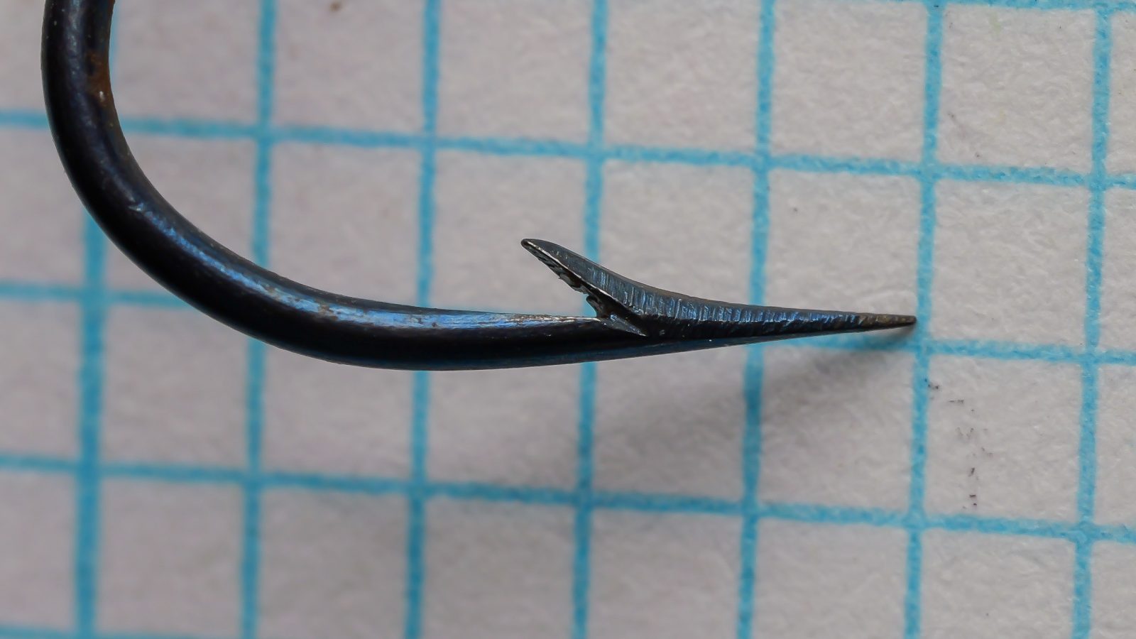 H. Milward & Sons 5644F hollow point construction size 21 — lateral view showing the hand-filed concave inner face of the point