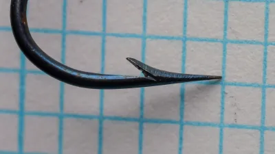 H. Milward & Sons 5644F hollow point construction size 21 — lateral view showing the hand-filed concave inner face of the point
