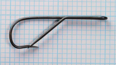 Mustad 3177 Superior Barbless — full profile view showing Kirby bend — size 10 — long shank proportions