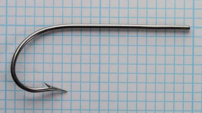 Mustad 3311 — full side profile of complete hook — No. 17 — showing marked shank, Kirbed bend, and bright finish