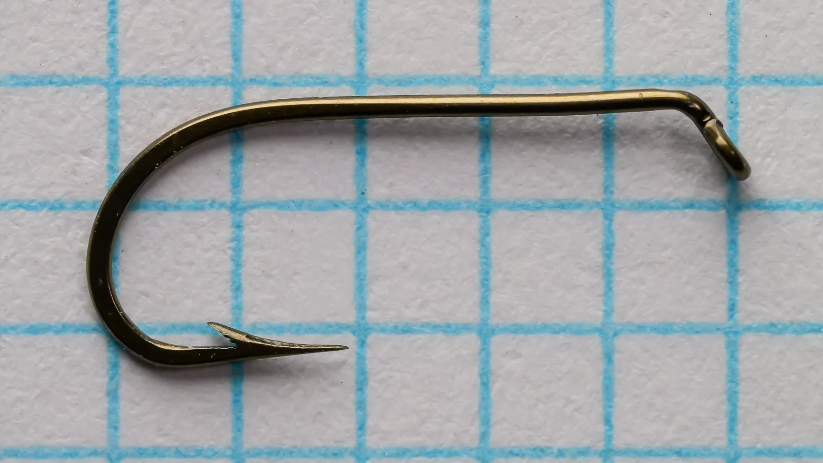 Mustad 94833 Viking Hooks — side profile showing forged Sproat bend and tapered eye — size 12 — bronzed finish on measurement grid