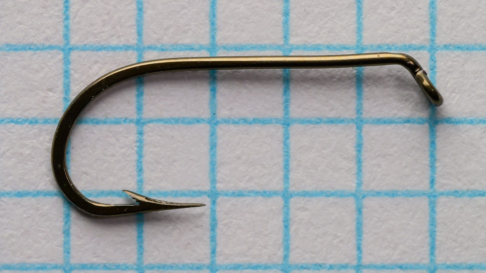 Mustad 94833 Viking Hooks — side profile showing forged Sproat bend and tapered eye — size 12 — bronzed finish on measurement grid