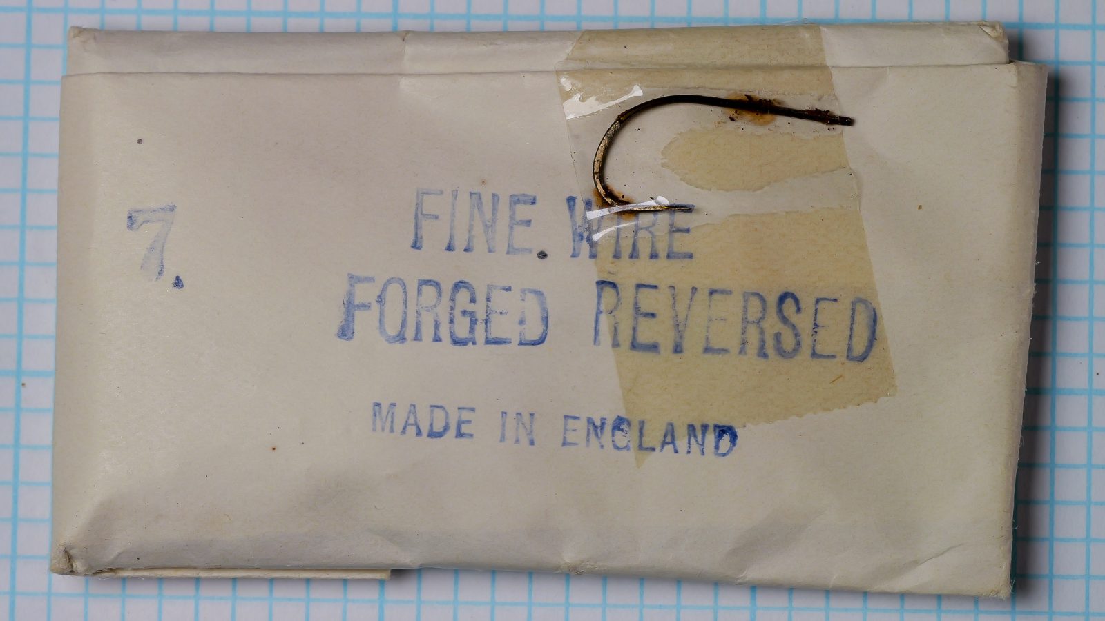 Partridge Fine Wire Forged Reversed Size 7 — original off-white cardstock packet with blue rubber-stamp printed text and Made in England marking