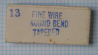 Partridge Fine Wire Round Bend Tapered — original hand-stamped cream card packet labeled '13 FINE WIRE ROUND BEND TAPERED' — showing Redditch factory stock