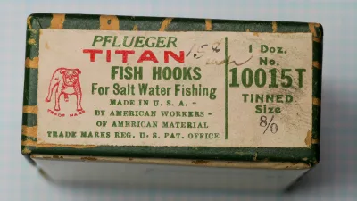 Pflueger Titan 10015T — original cloth-covered box with tan letterpress label showing red and green printing — size 8/0 — hand-forged American saltwater hook box from c. 1920-1945