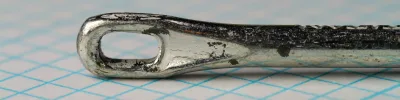 Pflueger Titan 10015T — tapered eye detail showing needle eye formation — size 8/0 — smooth wire taper without ball element